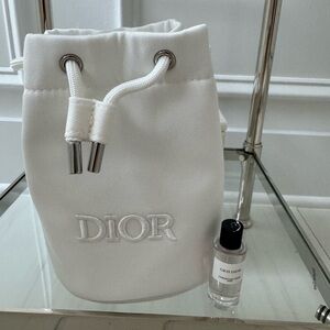 White Dior bucket drawstring cosmetic bag with Gris Dior perfume